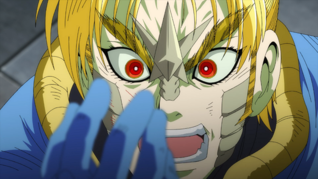 Kamui looking enragedhe's a blonde man wearing a blue pilot suit. He has red eyes and some reptilian stuff on his face