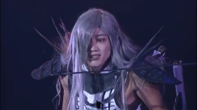 screenshots of Akechi looking surprised at the sight of a blade at his face, only to grin right afterward