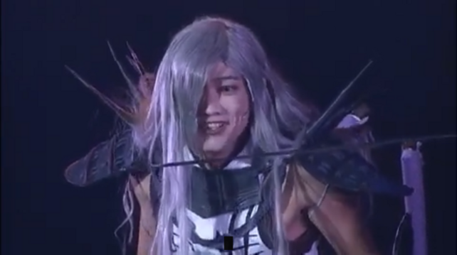 screenshots of Akechi looking surprised at the sight of a blade at his face, only to grin right afterward